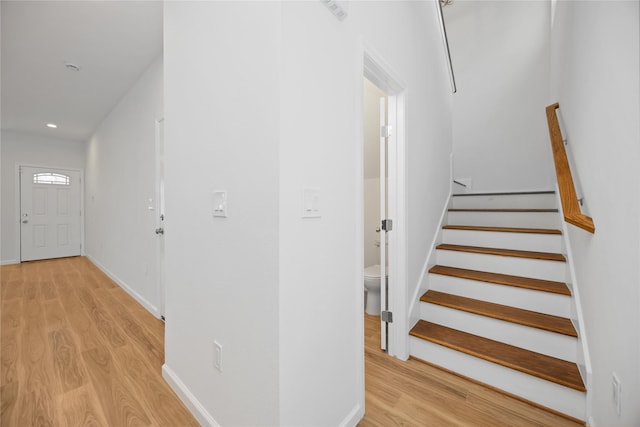 8923 De Priest St, Houston, TX 77088 - stairs featuring wood finished floors and recessed lighting