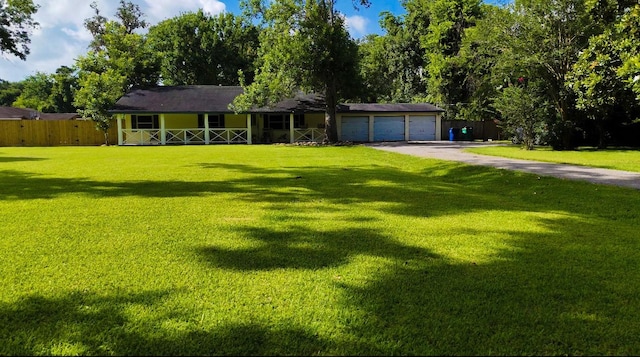 141 Cypress Dr, Richwood, TX 77531 - ranch-style home with a porch, asphalt driveway, and an attached garage