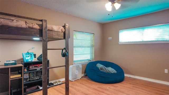 141 Cypress Dr, Richwood, TX 77531 - bedroom featuring wood finished floors and ceiling fan
