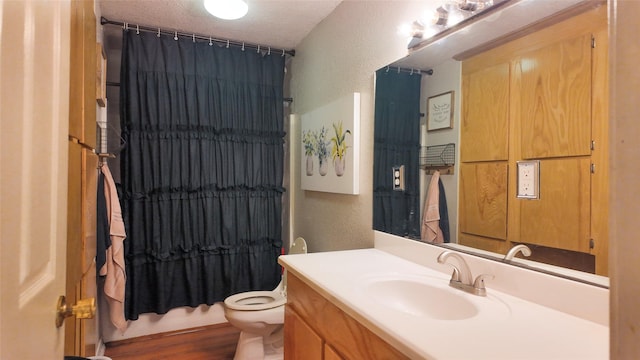 141 Cypress Dr, Richwood, TX 77531 - full bath featuring a textured wall, vanity, a shower with shower curtain, a textured ceiling, and wood finished floors