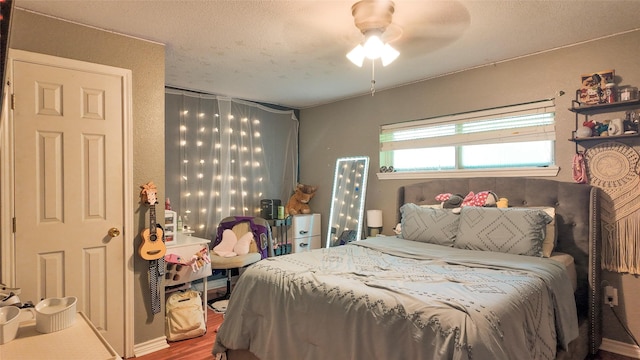 141 Cypress Dr, Richwood, TX 77531 - bedroom with wood finished floors, a textured ceiling, and ceiling fan
