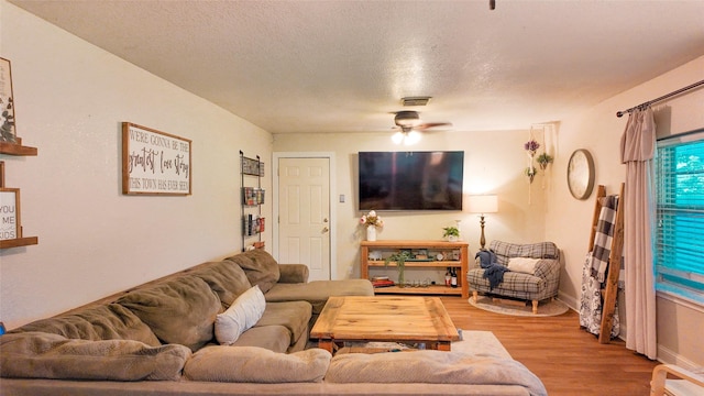 141 Cypress Dr, Richwood, TX 77531 - living area with ceiling fan, wood finished floors, and a textured ceiling