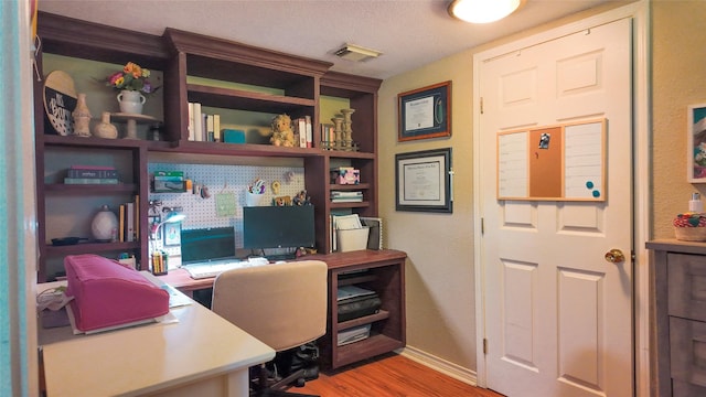 141 Cypress Dr, Richwood, TX 77531 - office area featuring wood finished floors and baseboards