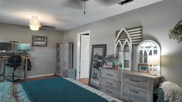 141 Cypress Dr, Richwood, TX 77531 - bedroom with wood finished floors and a ceiling fan