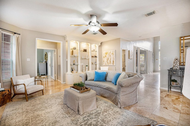 2602 Orleans Dr, Seabrook, TX 77586 - living room featuring a ceiling fan, healthy amount of natural light, and built in shelves