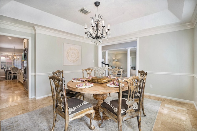 2602 Orleans Dr, Seabrook, TX 77586 - dining area featuring a chandelier, a tray ceiling, ornate columns, and ornamental molding