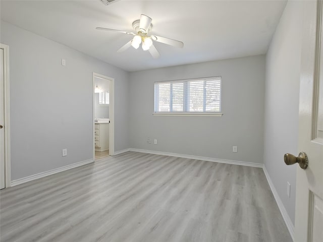 8818 Roos Rd, Houston, TX 77036 - unfurnished bedroom featuring light wood finished floors, connected bathroom, and ceiling fan