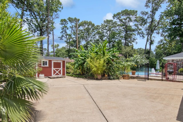 355 Cumberland Trl, Conroe, TX 77302 - view of patio featuring a shed