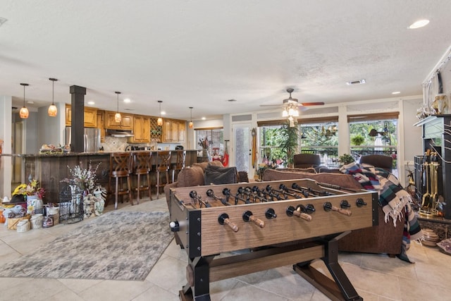 355 Cumberland Trl, Conroe, TX 77302 - rec room with recessed lighting, ceiling fan, and light tile patterned floors