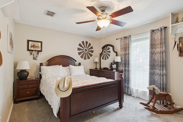 355 Cumberland Trl, Conroe, TX 77302 - carpeted bedroom featuring a ceiling fan and baseboards