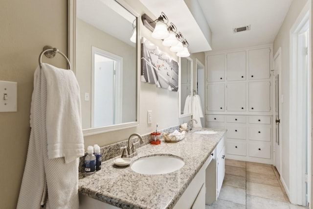 355 Cumberland Trl, Conroe, TX 77302 - bathroom featuring double vanity and tile patterned flooring