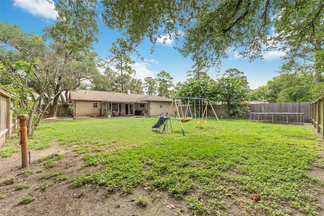 3543 Acorn Springs Ln, Spring, TX 77389 - fenced backyard featuring a playground