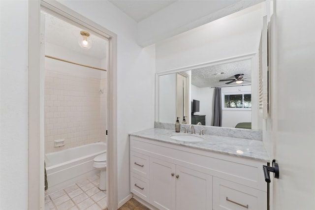 3543 Acorn Springs Ln, Spring, TX 77389 - bathroom with vanity, tub / shower combination, a textured ceiling, and ceiling fan