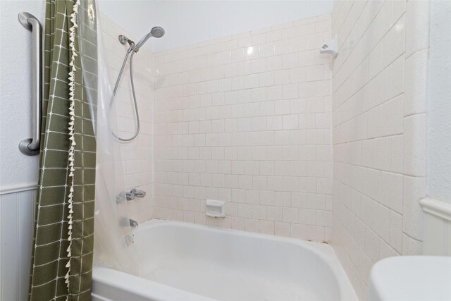 3543 Acorn Springs Ln, Spring, TX 77389 - bathroom with tub / shower combination and a wainscoted wall