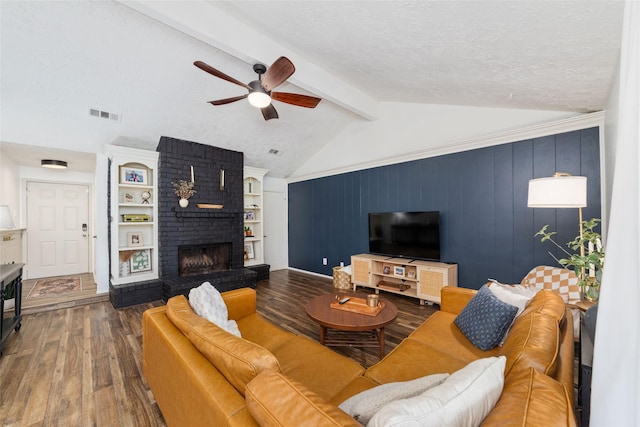 3543 Acorn Springs Ln, Spring, TX 77389 - living area with wood finished floors, a ceiling fan, and a fireplace