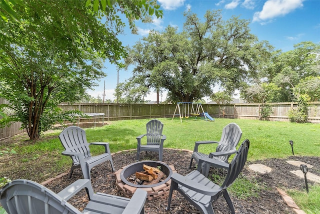3543 Acorn Springs Ln, Spring, TX 77389 - fenced backyard with an outdoor fire pit and a playground