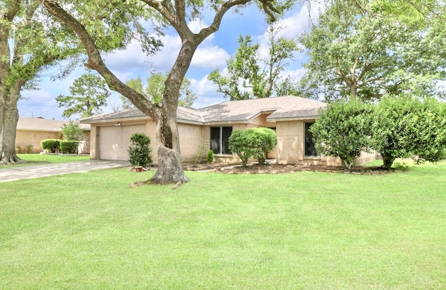 16307 N Mist Dr, Houston, TX 77073 - ranch-style home featuring an attached garage, driveway, brick siding, and a front yard