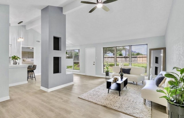 16307 N Mist Dr, Houston, TX 77073 - living room with beam ceiling, ceiling fan, wood finished floors, and high vaulted ceiling