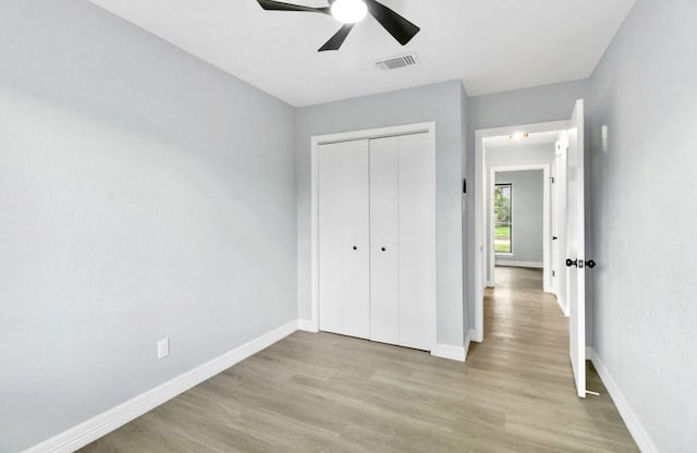 16307 N Mist Dr, Houston, TX 77073 - unfurnished bedroom with wood finished floors, a closet, and a ceiling fan