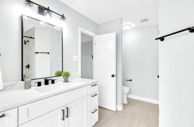 16307 N Mist Dr, Houston, TX 77073 - bathroom featuring vanity, wood finished floors, and a tile shower