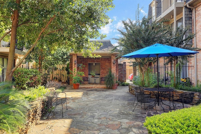 2400 N Braeswood Blvd Unit 108, Houston, TX 77030 - view of patio featuring outdoor dining area