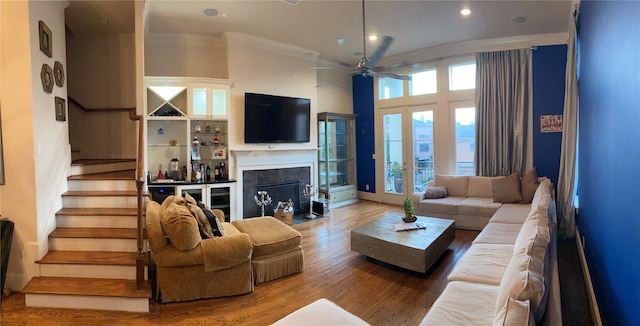5809 Larkin St, Houston, TX 77007 - living area with stairs, a ceiling fan, wood finished floors, recessed lighting, and ornamental molding