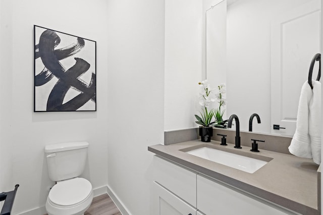 6417 Madrid St, Houston, TX 77021 - half bath featuring vanity and wood finished floors
