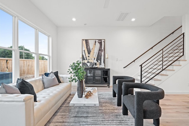 6417 Madrid St, Houston, TX 77021 - living area featuring wood finished floors, recessed lighting, and stairs
