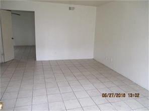 12308 Ormandy St, Houston, TX 77085 - unfurnished room featuring light tile patterned floors