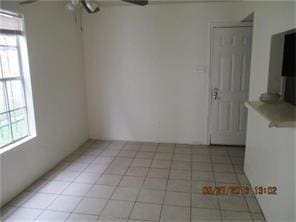 12308 Ormandy St, Houston, TX 77085 - unfurnished room with a ceiling fan and light tile patterned floors