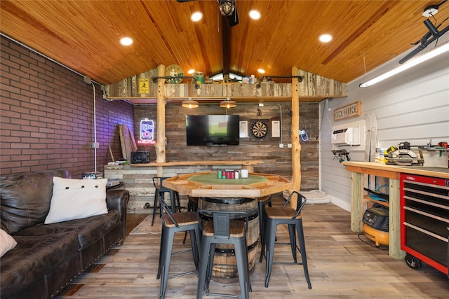14706 Sweet Water Dr, Baytown, TX 77523 - dining area featuring wooden walls, wood ceiling, lofted ceiling, wood finished floors, and brick wall