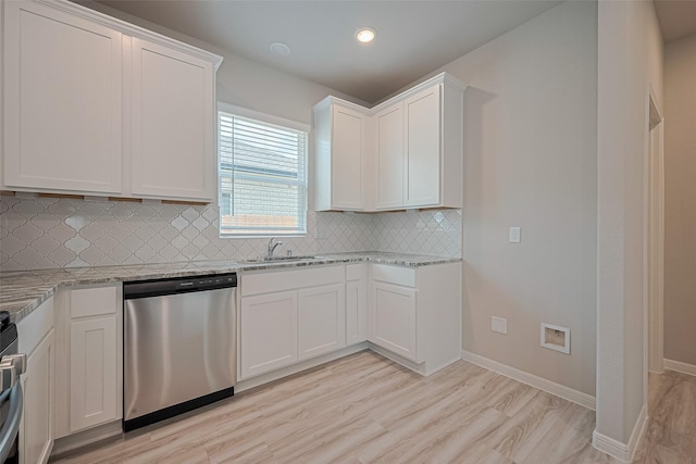 27222 Clear Breeze Dr, Katy, TX 77493 - kitchen with stainless steel dishwasher, light stone counters, tasteful backsplash, white cabinetry, and recessed lighting