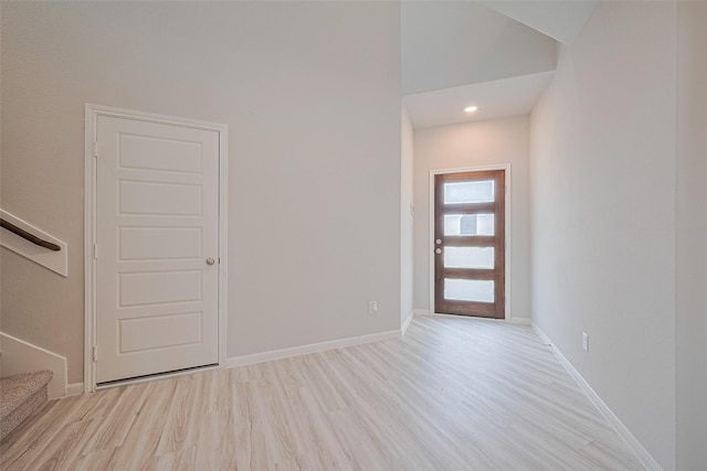 27222 Clear Breeze Dr, Katy, TX 77493 - entrance foyer featuring light wood finished floors, stairs, and recessed lighting