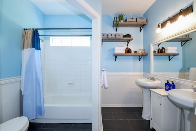 22035 Buescher Rd, Tomball, TX 77377 - full bathroom with tile patterned floors, a wainscoted wall, and shower / bathtub combination with curtain
