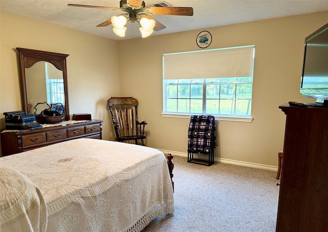 22035 Buescher Rd, Tomball, TX 77377 - carpeted bedroom featuring baseboards and a ceiling fan