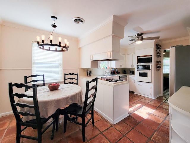 5439 Loch Lomond Dr, Houston, TX 77096 - dining area featuring ornamental molding, a chandelier, and a ceiling fan