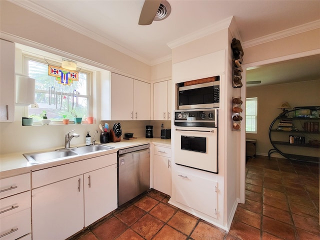 5439 Loch Lomond Dr, Houston, TX 77096 - kitchen with appliances with stainless steel finishes, white cabinetry, ornamental molding, light countertops, and dark stone finish flooring