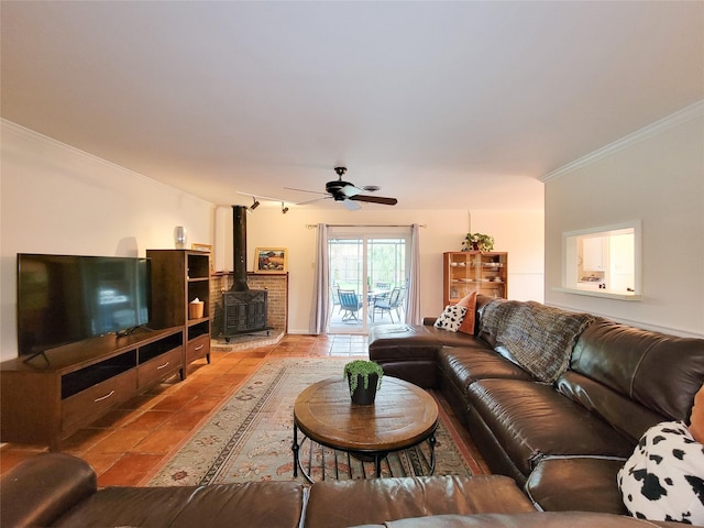 5439 Loch Lomond Dr, Houston, TX 77096 - living room with a wood stove, crown molding, tile patterned floors, and ceiling fan