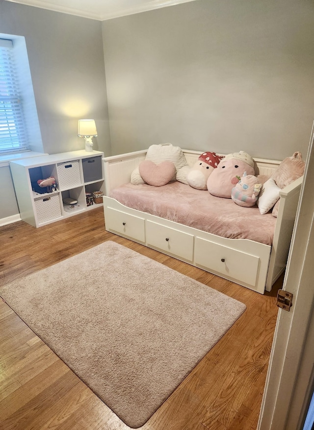 5439 Loch Lomond Dr, Houston, TX 77096 - bedroom featuring ornamental molding, wood finished floors, and a wainscoted wall