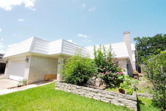 5 Tiffany Sq, Sugar Land, TX 77478 - view of property exterior with brick siding, a chimney, and driveway