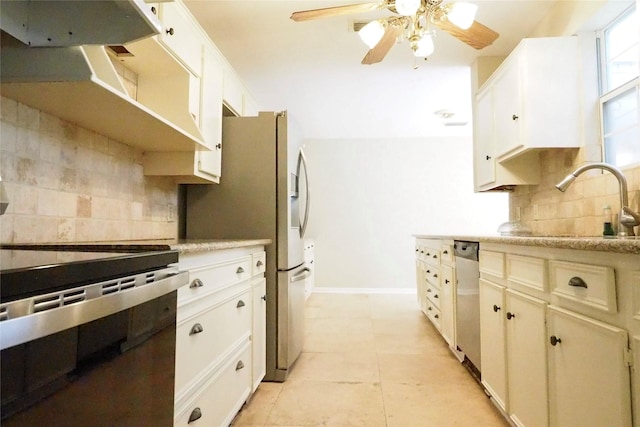 5 Tiffany Sq, Sugar Land, TX 77478 - kitchen featuring backsplash, appliances with stainless steel finishes, ceiling fan, light countertops, and white cabinets