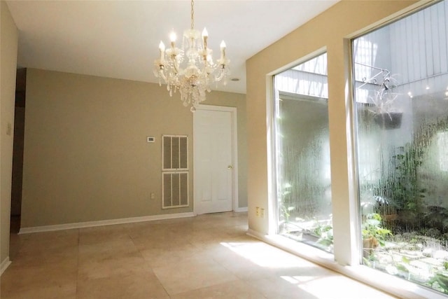 5 Tiffany Sq, Sugar Land, TX 77478 - spare room featuring a chandelier, healthy amount of natural light, and tile patterned floors