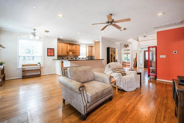 802 Lamonte, Houston, TX 77018 - living room featuring ceiling fan, crown molding, light wood-style flooring, and recessed lighting