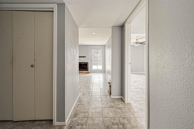 13480 S Thorntree Dr Unit 508, Houston, TX 77015 - hall featuring light tile patterned floors and a textured wall