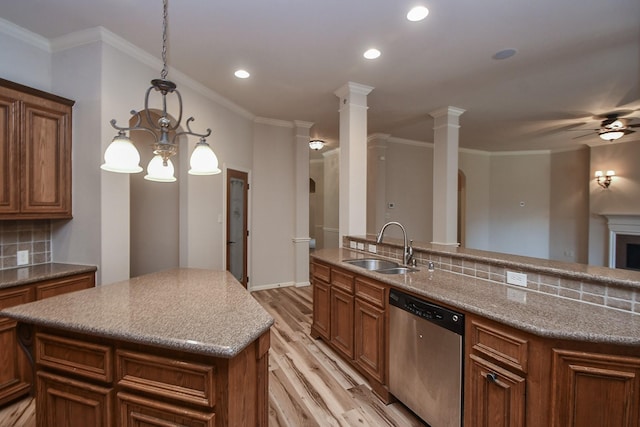 26622 Boulder Cove Ct, Katy, TX 77494 - kitchen featuring stainless steel dishwasher, a kitchen island, light wood finished floors, tasteful backsplash, and recessed lighting