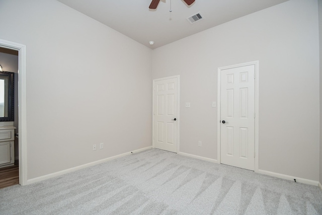 26622 Boulder Cove Ct, Katy, TX 77494 - spare room featuring ceiling fan, light carpet, and vaulted ceiling