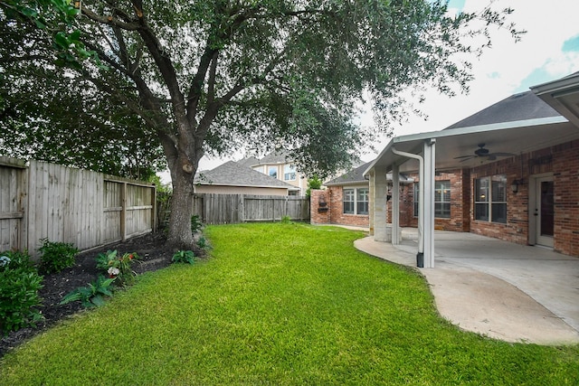 26622 Boulder Cove Ct, Katy, TX 77494 - fenced backyard with ceiling fan and a patio area