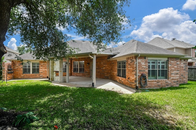 26622 Boulder Cove Ct, Katy, TX 77494 - rear view of house with brick siding, a yard, and a patio area