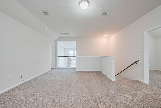 23607 Acerola Tree Ct, Katy, TX 77493 - unfurnished room with light carpet, vaulted ceiling, and a smoke detector