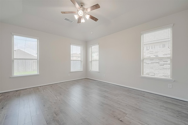 23607 Acerola Tree Ct, Katy, TX 77493 - spare room with ceiling fan, healthy amount of natural light, and wood finished floors